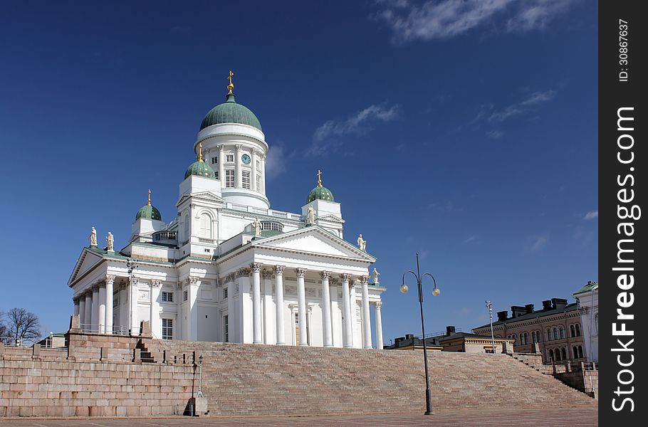 Finnish Evangelical Lutheran Cathedral of the Diocese of Helsinki against deep blue sky. Finnish Evangelical Lutheran Cathedral of the Diocese of Helsinki against deep blue sky.