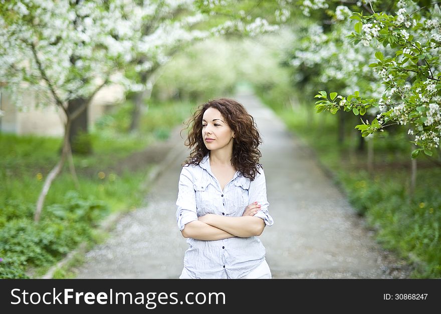 Good looking woman in a spring garden. Good looking woman in a spring garden