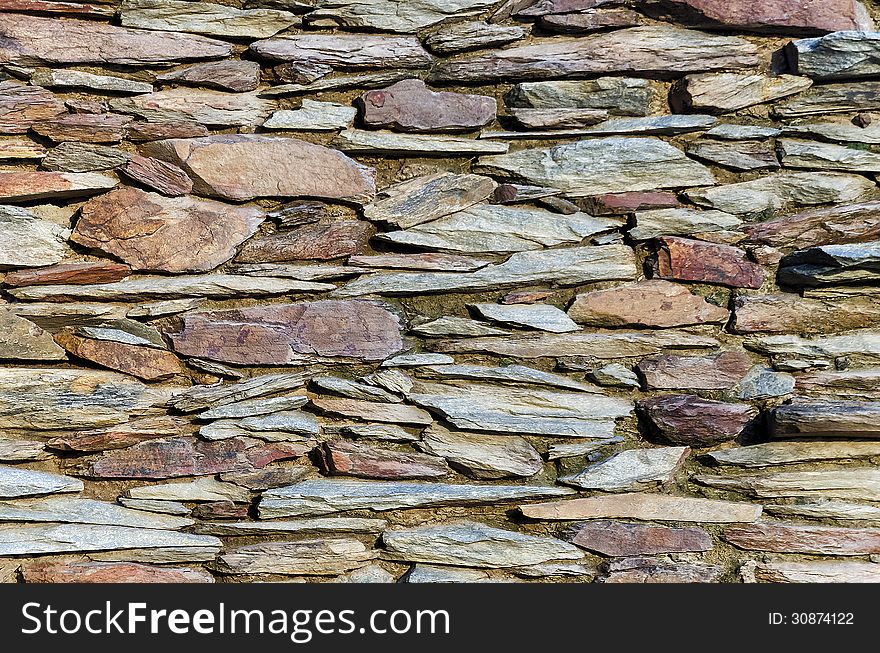 A stone wall background.