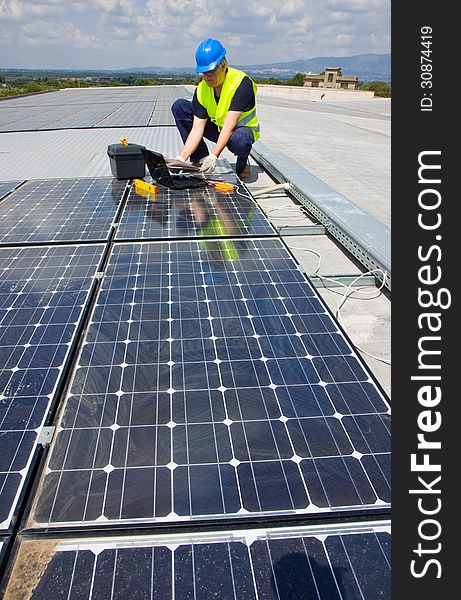 Craftsman at work in a plant for sun energy photovoltaic