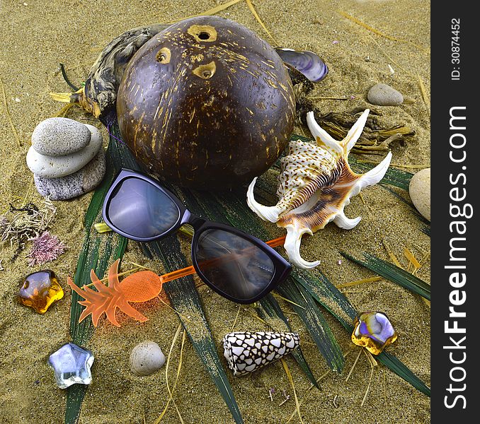Still life of sunglasses and nautical objects on the sand. Still life of sunglasses and nautical objects on the sand