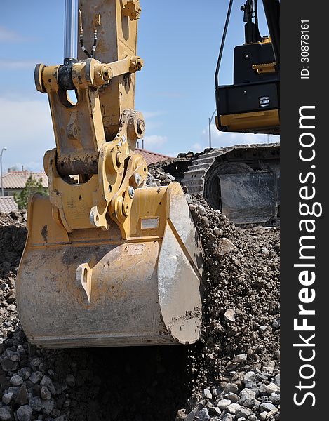 This is a hydraulic excavator with a 2 cubic yard bucket attached, digging in loose soil and rock. This is a hydraulic excavator with a 2 cubic yard bucket attached, digging in loose soil and rock.