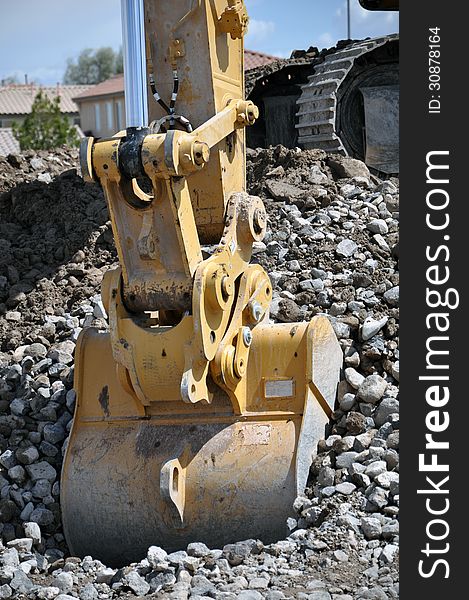 This is a hydraulic excavator with a 2 cubic yard bucket attached, digging in loose soil and rock. This is a hydraulic excavator with a 2 cubic yard bucket attached, digging in loose soil and rock.