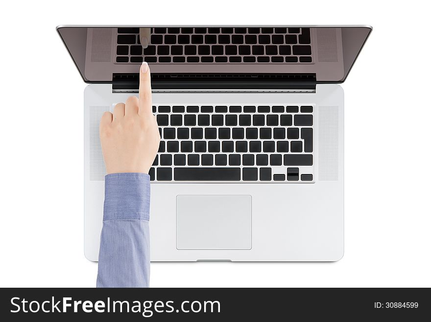 Top view of modern retina laptop with a woman's hand pointing at the screen on white background. You can put any image on the screen, while retaining reflection of keyboard. Top view of modern retina laptop with a woman's hand pointing at the screen on white background. You can put any image on the screen, while retaining reflection of keyboard.