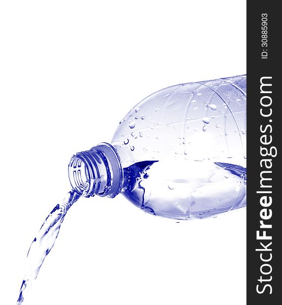 Water pours from a plastic bottle isolated on white background. Water pours from a plastic bottle isolated on white background