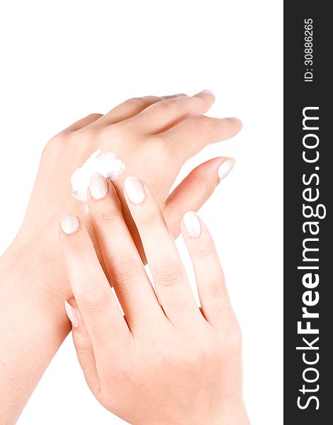 Female applying hand cream on white. Female applying hand cream on white
