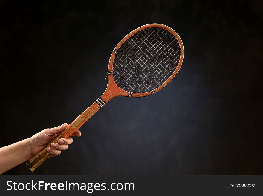 Vintage tennis racket isolated on a neutral background