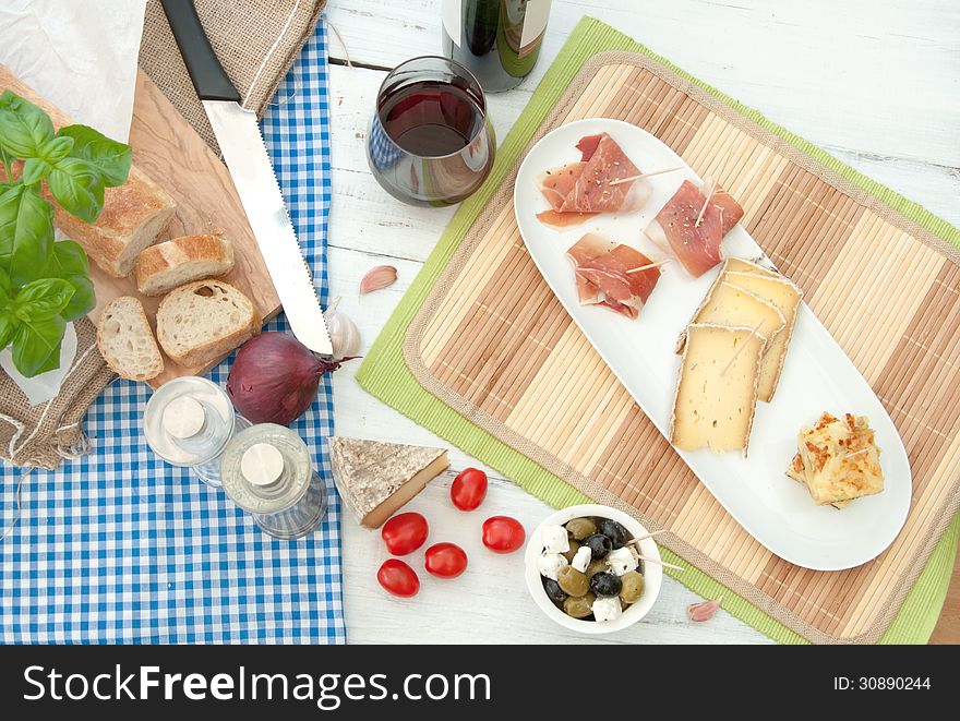 Platter consisting of potato omelette, cheese and serrano ham. Platter consisting of potato omelette, cheese and serrano ham