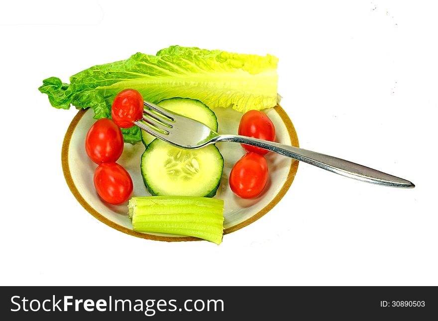 Salad on a plate with a fork.