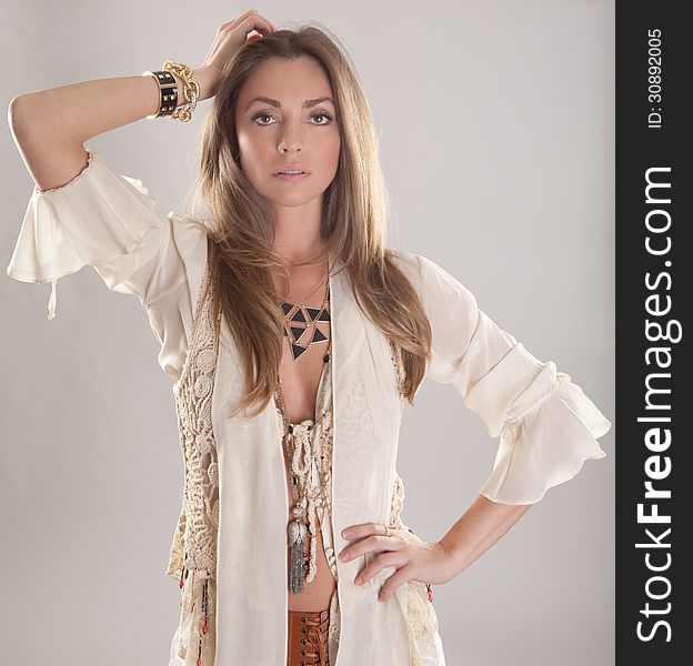 An image of a fashion model in a boho outfit. An image of a fashion model in a boho outfit