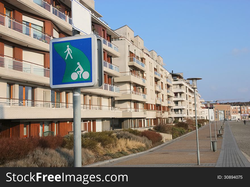 A pedestrian street in a residential area along a harbor basin