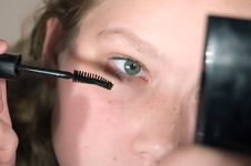 Young Girl And Mascara Stock Images