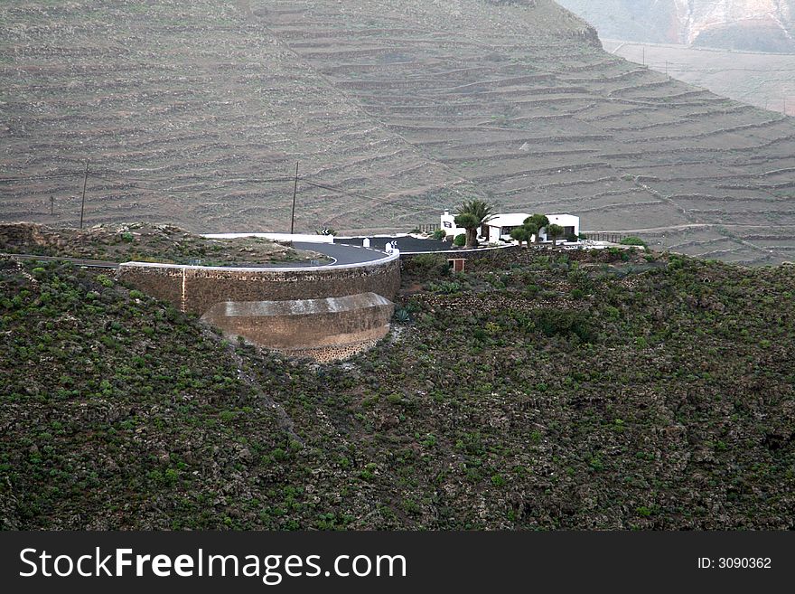 Steep road curve on top a hill. Steep road curve on top a hill