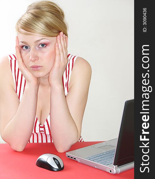 Photo of an attractive young woman at work on her laptop computer. Photo of an attractive young woman at work on her laptop computer