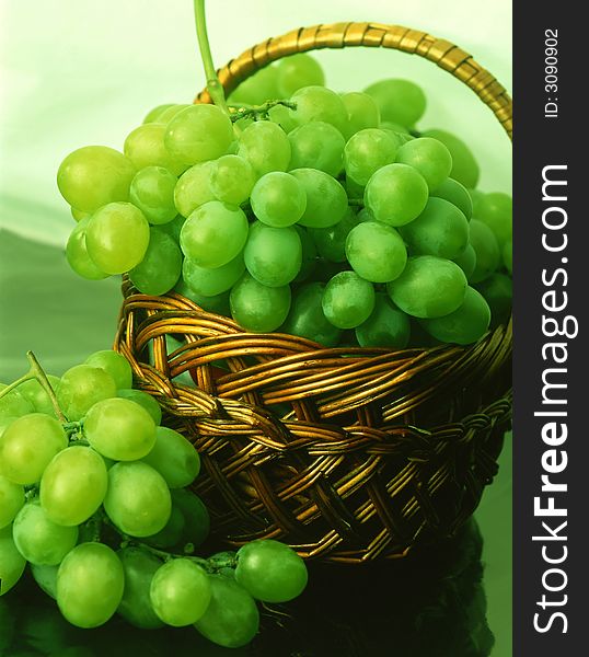 Green grapes on a dark blue background