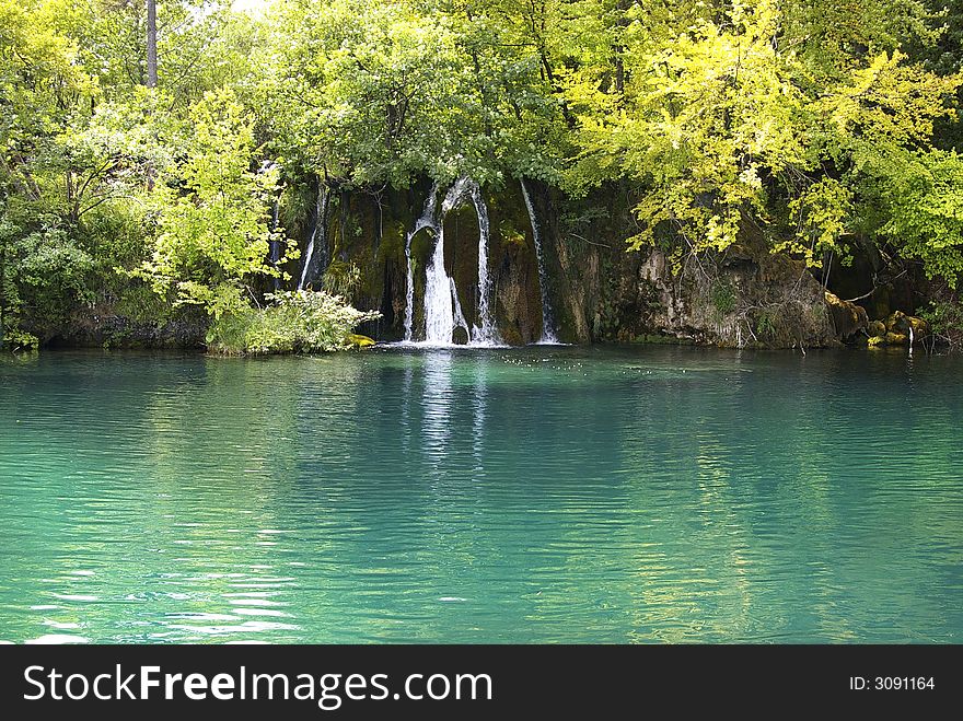 Beautiful turquoise lake and waterfall