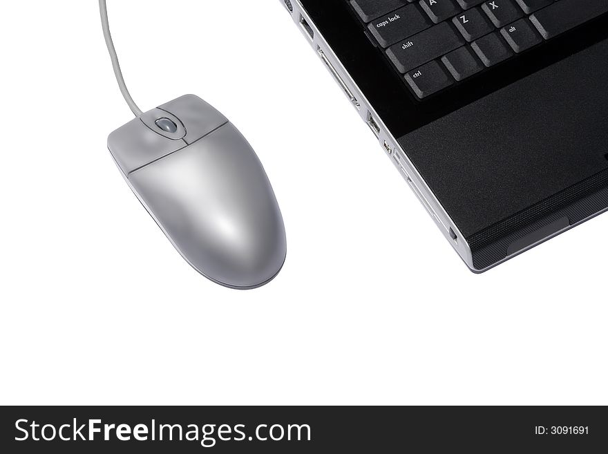 Silver Mouse And Black Laptop On A White Background. Silver Mouse And Black Laptop On A White Background