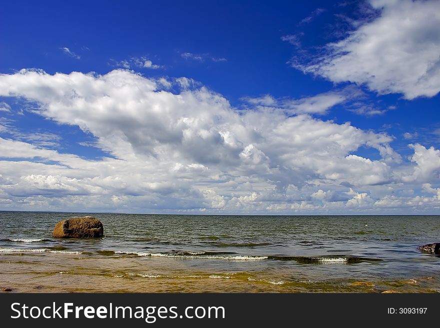 Landscape with blue sky, clouds, stones and sea. Landscape with blue sky, clouds, stones and sea