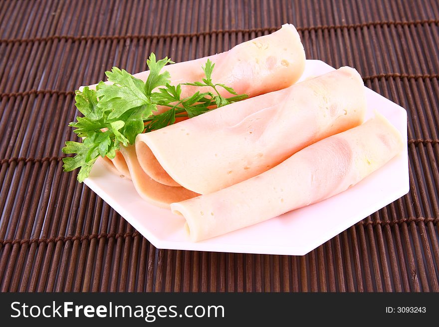 Ham slices on fork with top slice folded