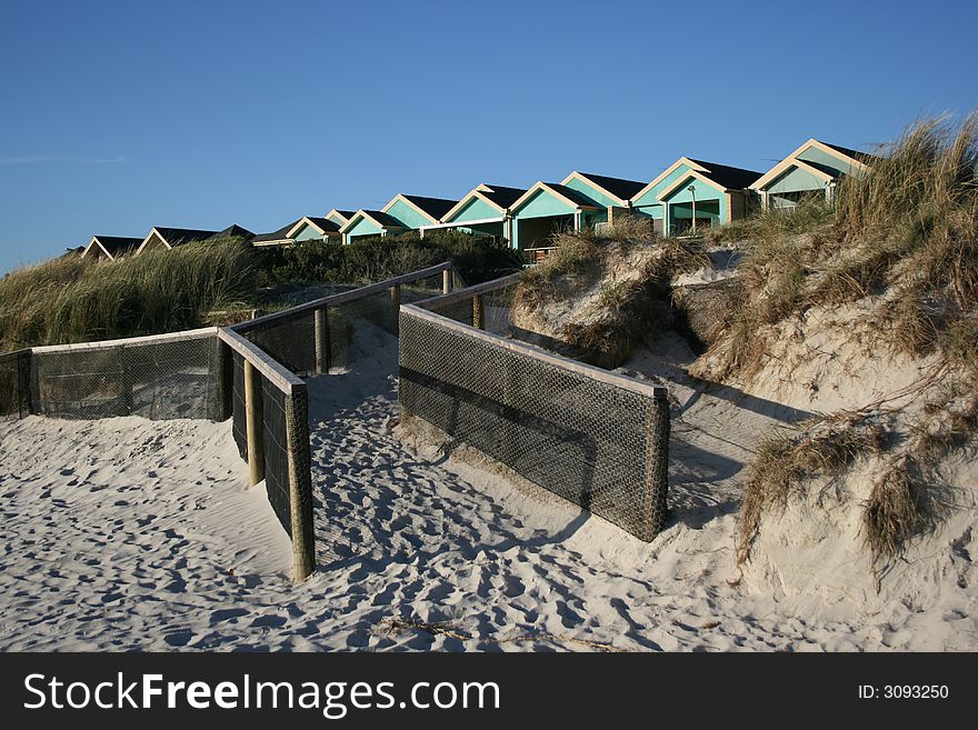 Way down to the beach with seaside houses in background