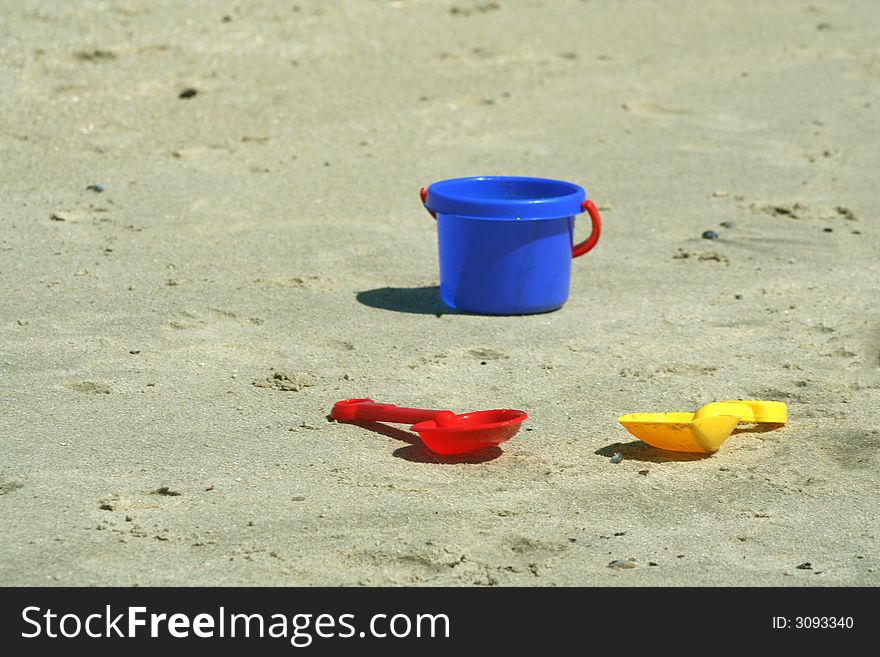 Shovels and pail on the beach