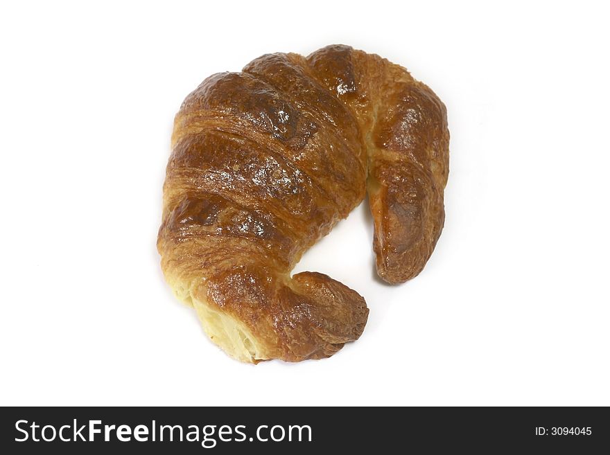 Croissant of butter for the coffee in the breakfast