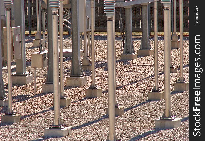 Poles and shadows in an electric substation