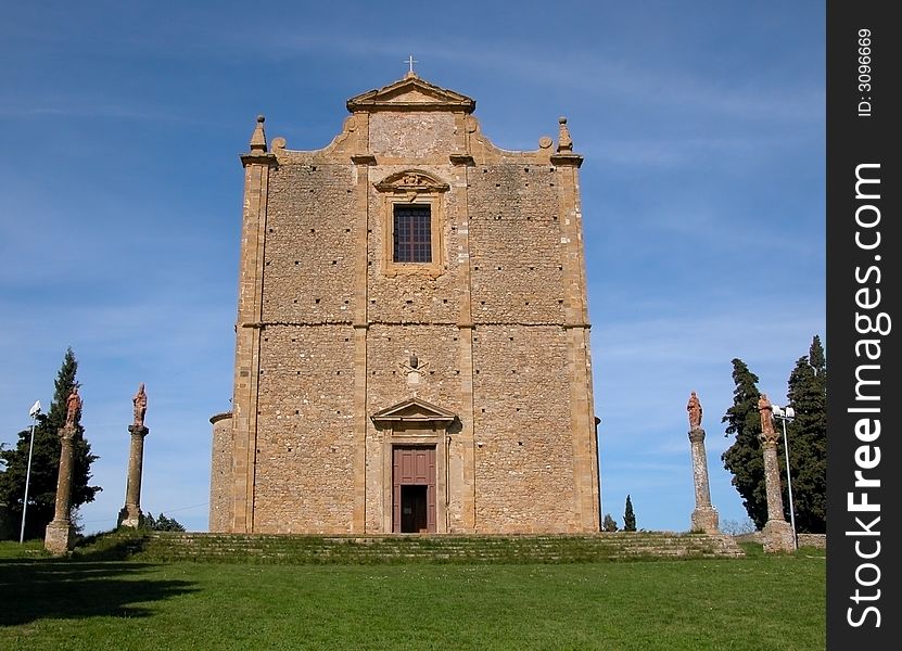 The church of Saint Justus in Volterra, Tuscany, which sits isolated upon a green grassy hill. The church of Saint Justus in Volterra, Tuscany, which sits isolated upon a green grassy hill.