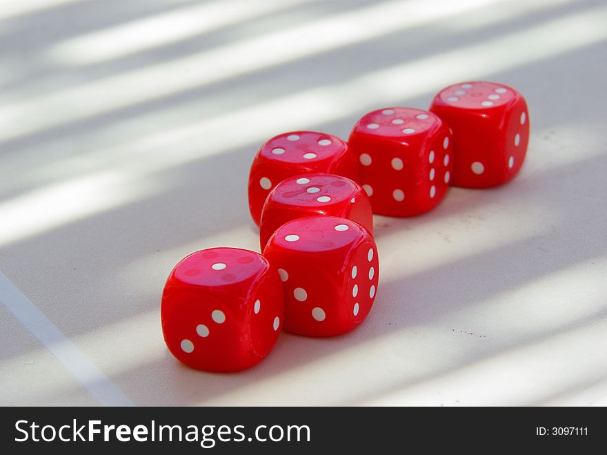 Tempting red dice on table