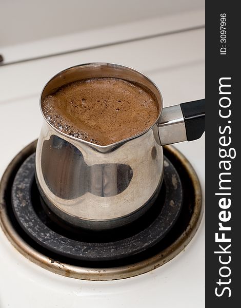 Preparing coffee in metal pot