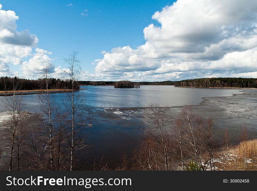 A lake in Finland in the late spring, ice cover almost melted. A lake in Finland in the late spring, ice cover almost melted.