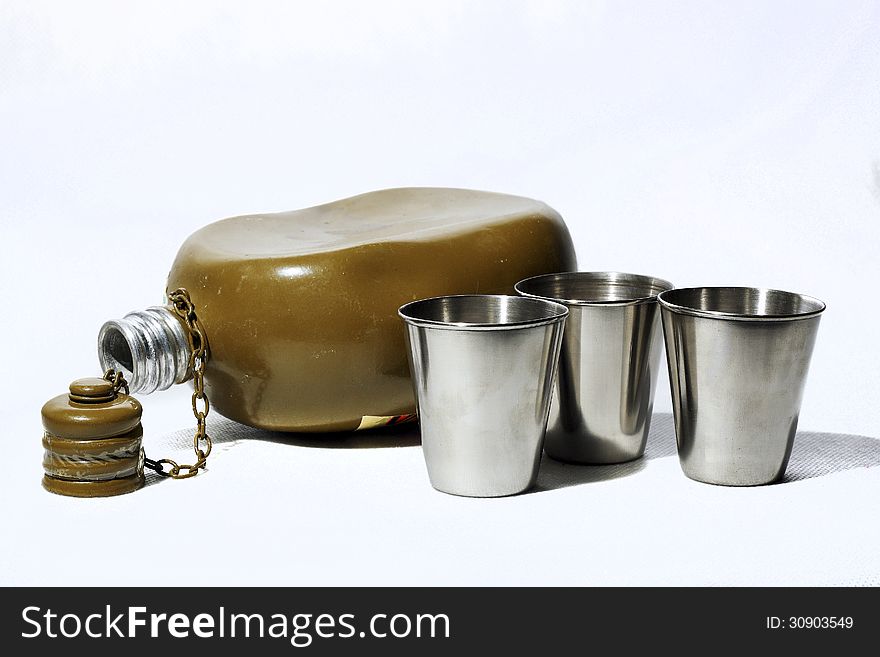 Metall flask and three wineglasses. Metall flask and three wineglasses