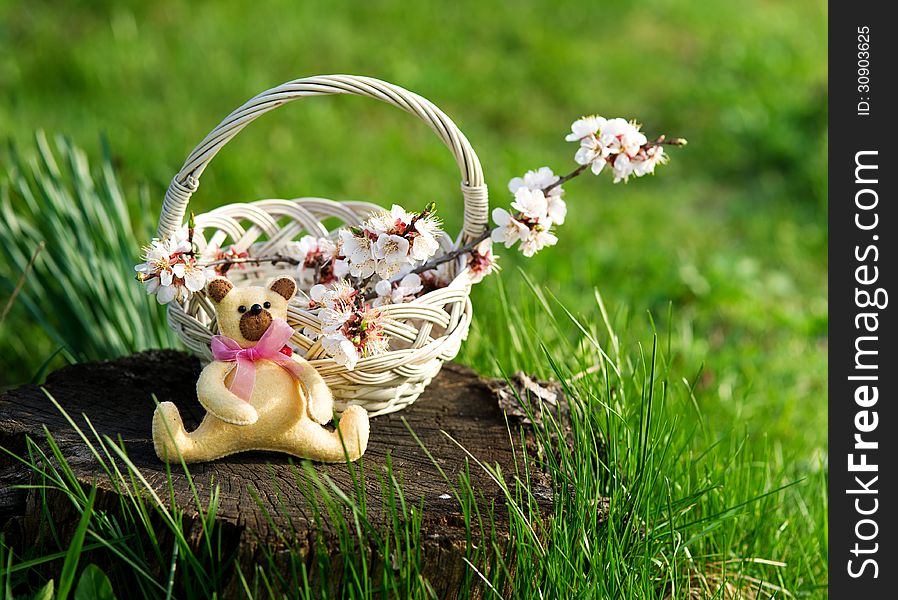 Wicker Basket With Flowers And Toy Bear