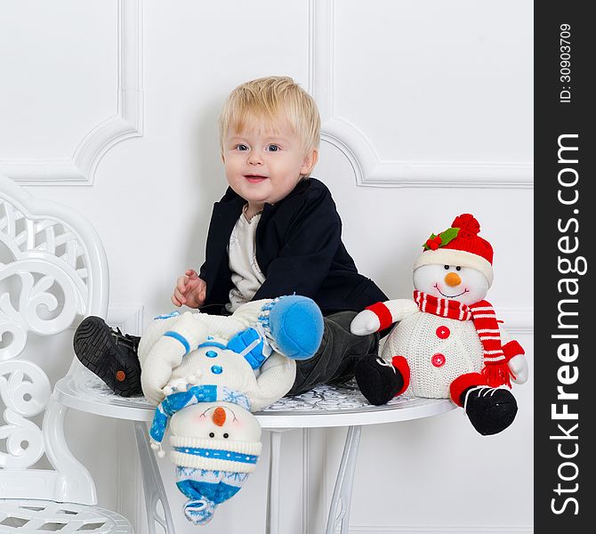 Adorable little boy with blue and red snowmen. Adorable little boy with blue and red snowmen