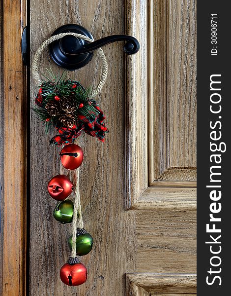 Christmas Ornament hanging from a wwoden door. Christmas Ornament hanging from a wwoden door