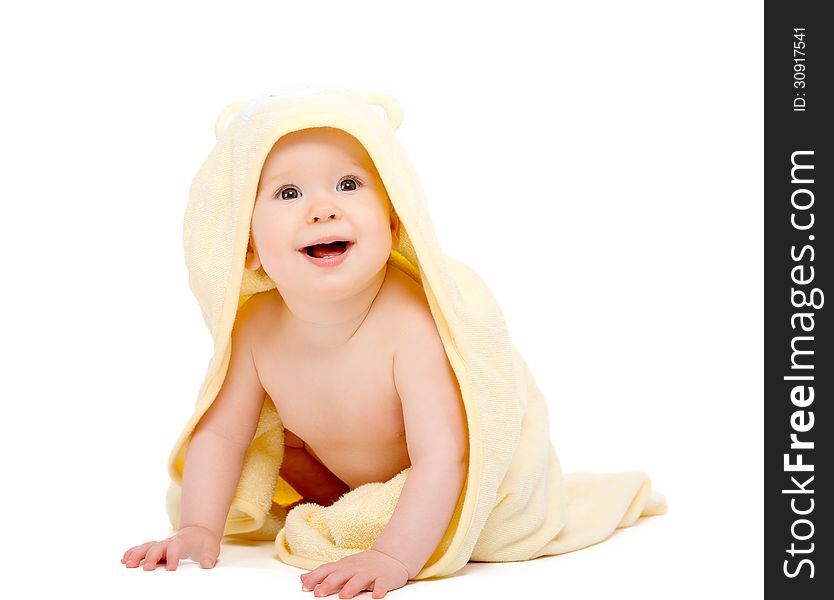 Happy beautiful baby in yellow towel isolated on white background