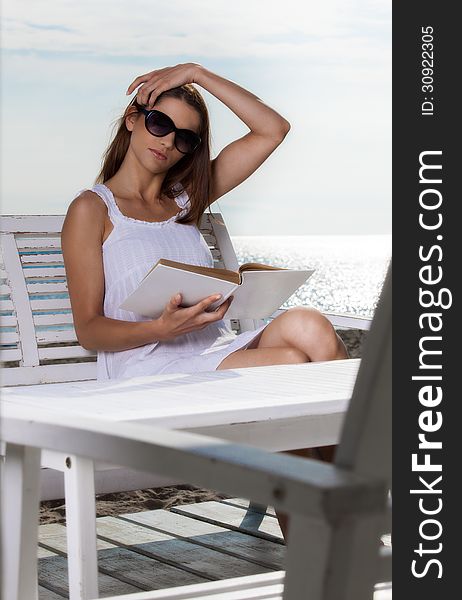 Pretty young woman relaxing on the beach