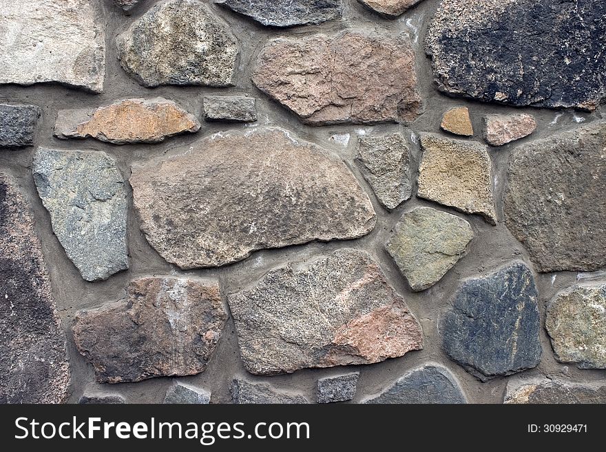 Wall from a natural stone. Wall from a natural stone.