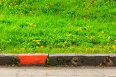 Border Marking Infront Of Green Grass Stock Photo Border Marking Infront Of Green Grass Stock Photo