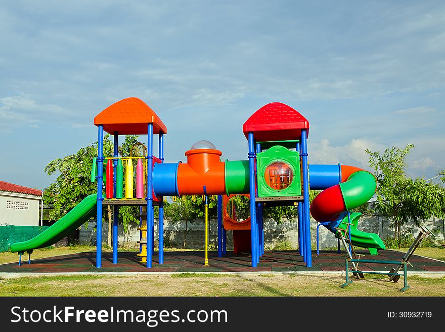 Colourful playground blue sky background