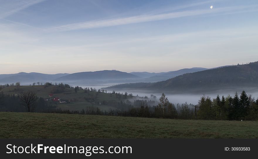 Morning fog in the mountains in Southern Poland
