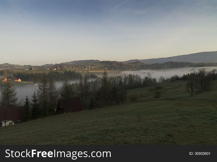 Morning fog in the mountains in Southern Poland