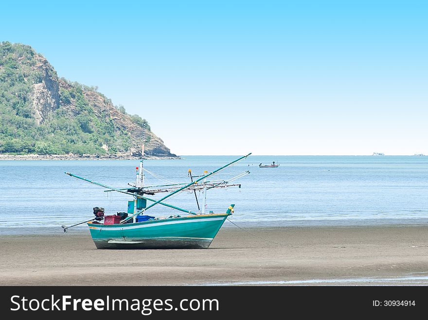 Fishing boat on the sea shore