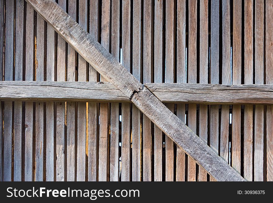 Old enclosure from weathered wooden planks and beams. Old enclosure from weathered wooden planks and beams