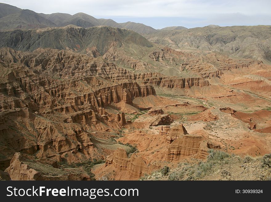 Valley of red mountains. Kyrgyzstan. A red canyon. Red mountains.