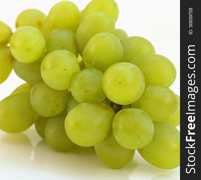 Bunch of grapes on a light background (details)