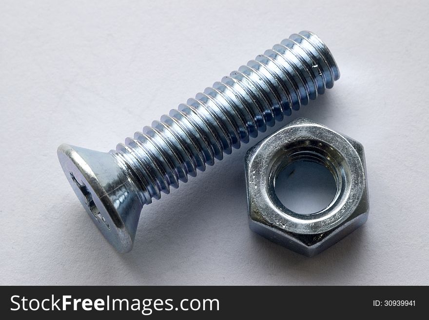 The large bolts and screws on a white background. The large bolts and screws on a white background.