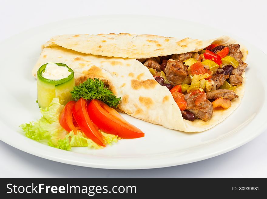Eastern spicy burrito with meat and vegetables