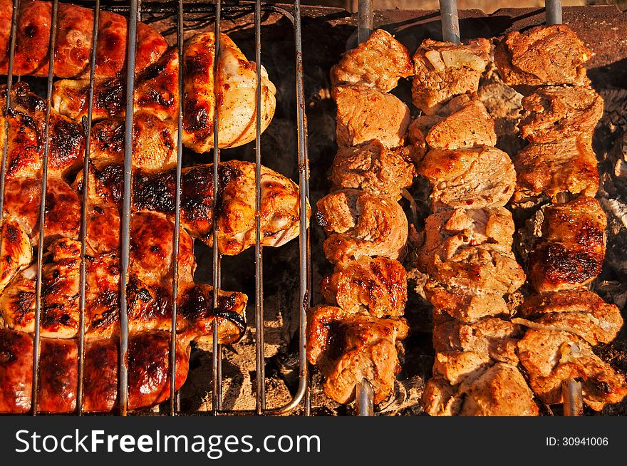 Grilled meat and chicken on barbecue. Grilled meat and chicken on barbecue