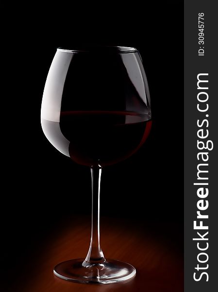 Wine glass with red wine. Isolated